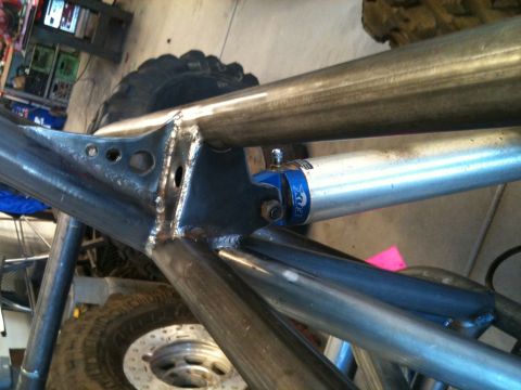 1966 Ford Bronco - Close-up of a custom off-road buggy frame, showing suspension components and metal fabrication.