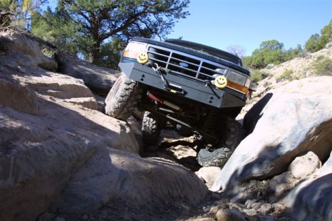 1994 Ford Bronco - This 1994 Ford Bronco is shown tackling a challenging off-road course with large rocks.