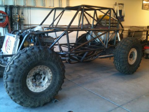 1966 Ford Bronco - Custom off-road buggy frame under construction, showing exposed engine and roll cage structure.