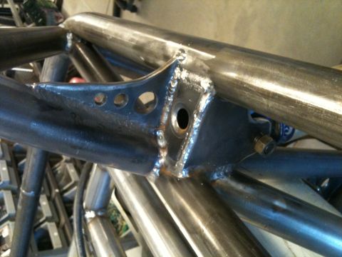 1966 Ford Bronco - Close-up of a custom metal frame, likely for off-road use, with visible welds and hardware.