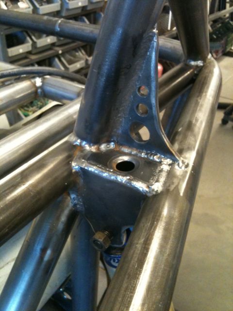 1966 Ford Bronco - Custom roll cage fabrication showing welded joints and a mounting bracket with multiple holes.