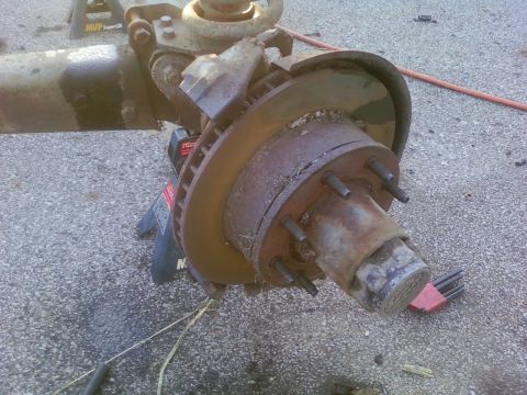 1989 Ford Bronco - This image shows a disassembled vehicle axle assembly, likely undergoing maintenance or repair.