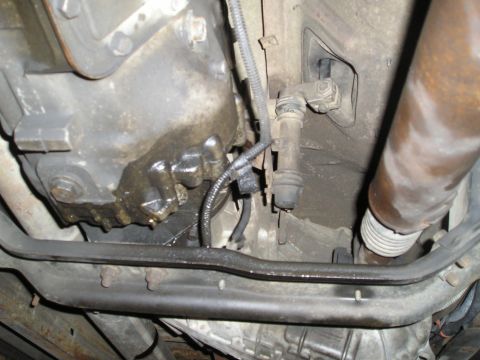 1997 Ford F-250 - Underside view of a vehicle's transmission and exhaust system, showing some leaks.