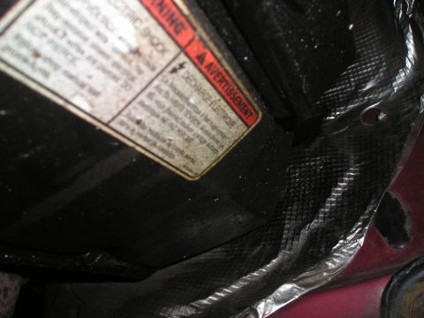 1997 Ford F-250 - Close-up of a warning label with electrical hazard information.