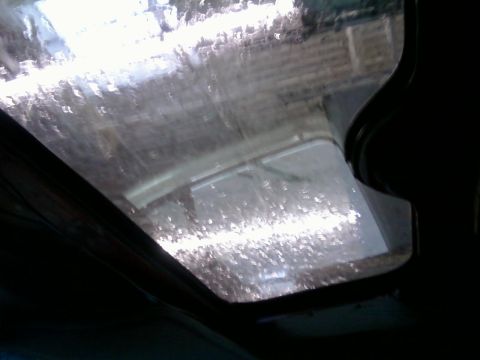 2000 Mercury Grand Marquis - View of the interior sunroof with water droplets on the glass.
