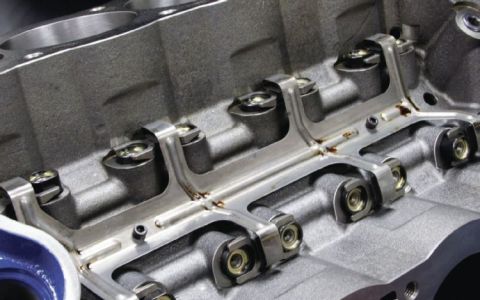 1990 Ford Bronco - Engine cylinder head components, including rocker arms and valve springs, are visible in this close-up view.