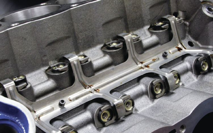 Close-up of engine cylinder head showing rocker arms and valve springs