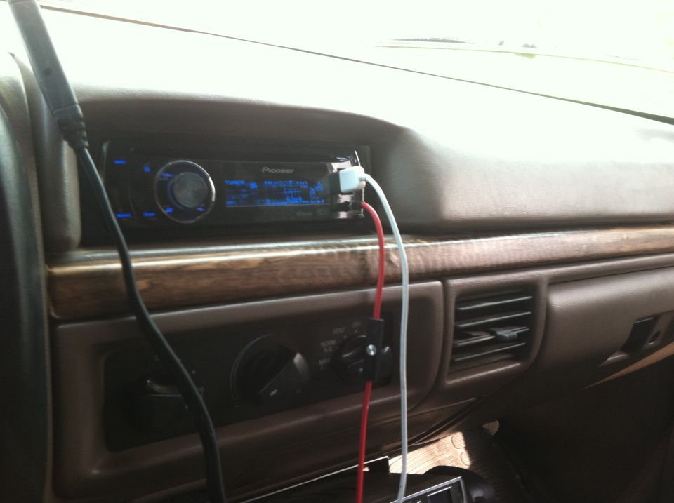 1994 Ford Bronco interior with Pioneer stereo and woodgrain dash trim