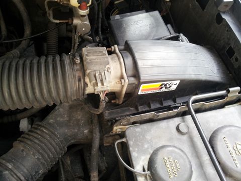 1995 Ford Bronco - Close-up of the engine bay, focusing on the air intake components and K&N filter.