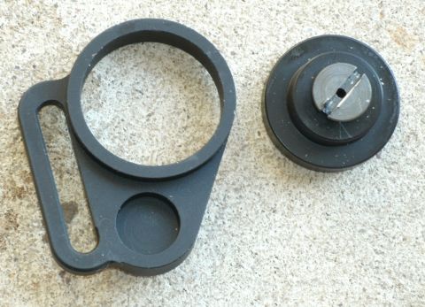 2000 Ford Crown Victoria - Two black automotive parts are shown on a concrete-like surface.