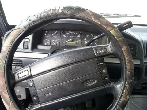 1995 Ford Bronco - Interior view of a 1995 Ford Bronco, the steering wheel and instrument cluster.