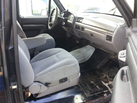 1995 Ford Bronco - Interior view of a truck's cabin, showing the seats and dashboard.