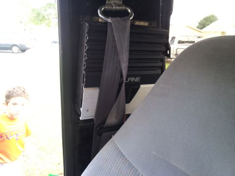 1995 Ford Bronco - Interior view of a car with an aftermarket amplifier installed.