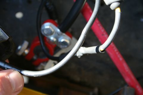 1982 Ford Bronco - Detail of automotive electrical wiring, focusing on battery terminals and connections.