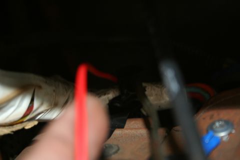 1982 Ford Bronco - A close-up view of electrical wiring and connections within a vehicle's interior or under the dash.