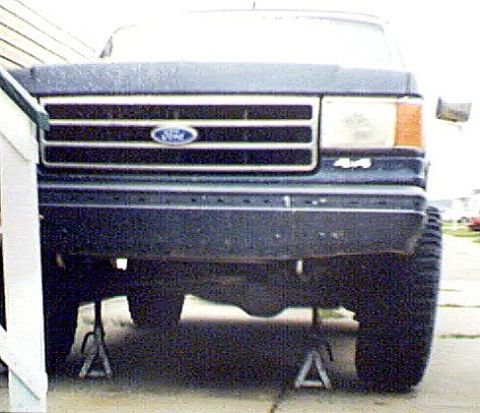 1989 Ford Bronco - Here's the front tire lifted off the ground. Tires were at an angle, due to wheel bearings..... 09/25/03