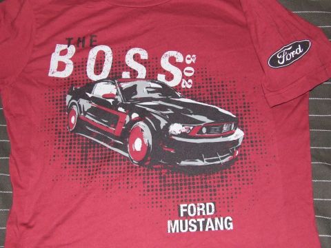 1973 Ford Mustang - A graphic t-shirt displays a black Ford Mustang with red accents and "The Boss 302" text.