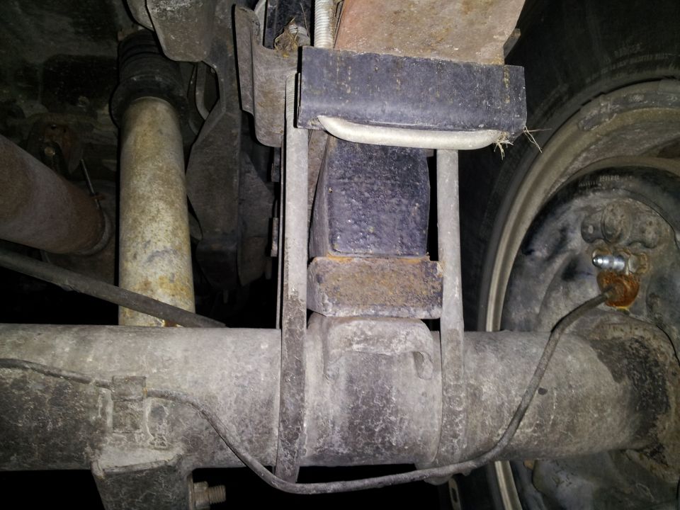 Rear suspension components with a Supermotors.net watermark
