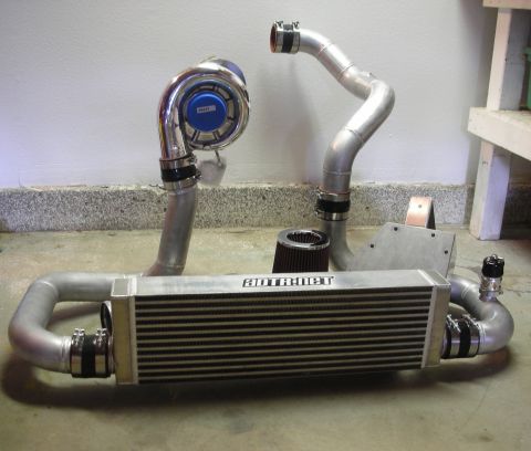 2004 Ford Crown Victoria - ADTR Performance supercharger kit components laid out on a concrete floor.