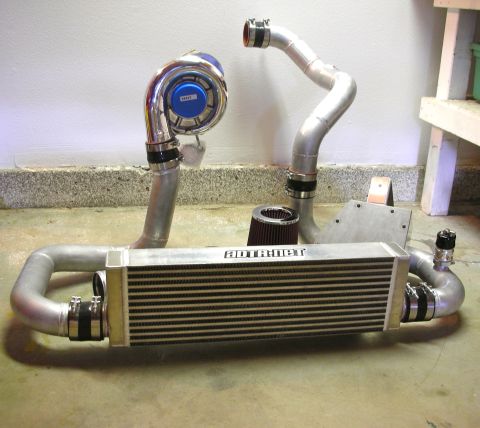 2004 Ford Crown Victoria - A supercharger system, including an intercooler and air filter, is laid out on the floor.