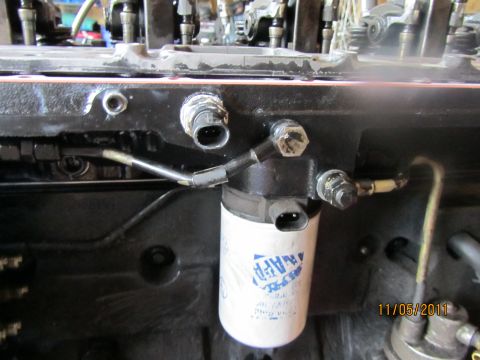 1984 Ford Bronco - Close-up view of engine components, including a NAPA fuel filter, with a date stamp of 11/05/2011.