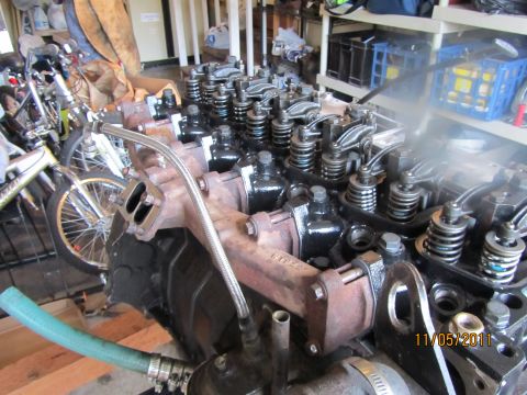 1984 Ford Bronco - Close-up view of an engine block, showing the valve train and exhaust manifold.