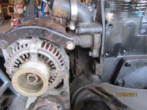 1984 Ford Bronco - Close-up view of engine components, including an alternator and coolant housing, with a date stamp of 11/05/2011.
