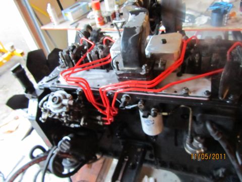 1984 Ford Bronco - Close-up view of an engine assembly, showing various components and wiring.