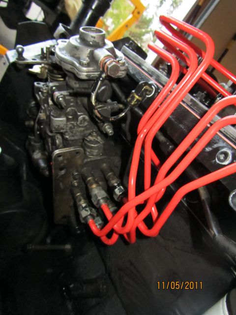 1984 Ford Bronco - Close-up of a diesel injection pump and red fuel lines, dated 11/05/2011.