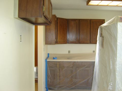 1984 Ford Mustang - Kitchen renovation in progress with cabinets and countertops covered for protection.