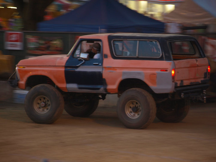 Orange and black 1978 Ford Bronco, 3/4 front view