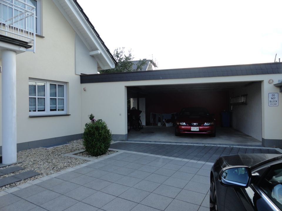 Red 2003 Mercury Marauder parked in garage