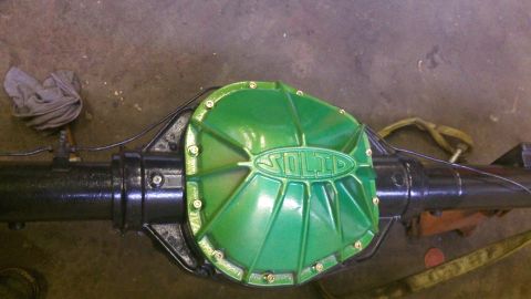 1979 Ford Bronco - Close-up of a green "SOLID" differential cover on a rear axle.