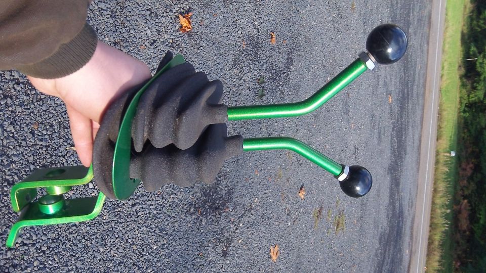 Dual green stick shift levers with black knobs