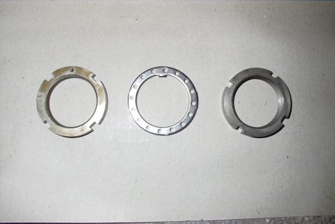 1995 Ford Bronco - Three different types of metal rings are shown, likely parts for a vehicle's hub assembly.