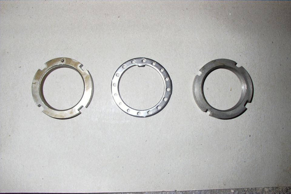Three metal rings, possibly hublock components, laid out on a flat surface