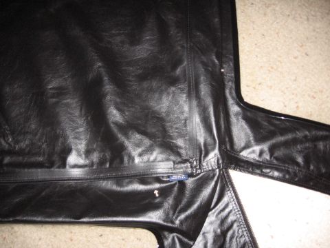 1995 Ford Bronco - Close-up of a black vinyl soft top section, possibly for a convertible or Jeep-like vehicle.