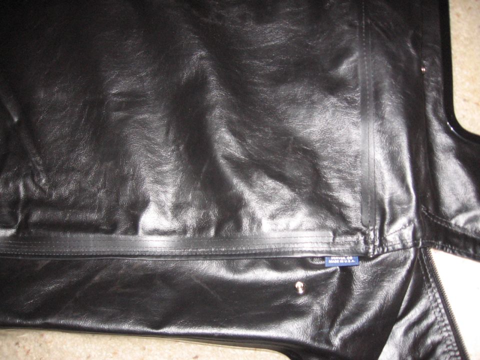 Folded black vinyl soft-top panel with a snap and 'Made in USA' tag.