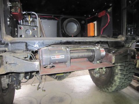 2008 Jeep Wrangler - A Warn XP 9.5 winch is mounted on a custom plate beneath the rear of a vehicle.