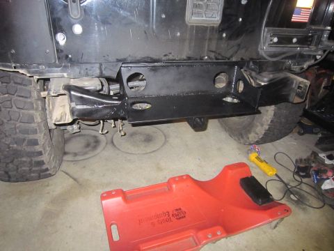 2008 Jeep Wrangler - Custom rear bumper bracket installed on a Jeep, with a creeper dolly and tools nearby.