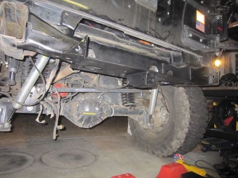 2008 Jeep Wrangler - The rear axle and suspension components of a Jeep Wrangler are visible, with a Dynatrac differential cover and Bilstein shocks.