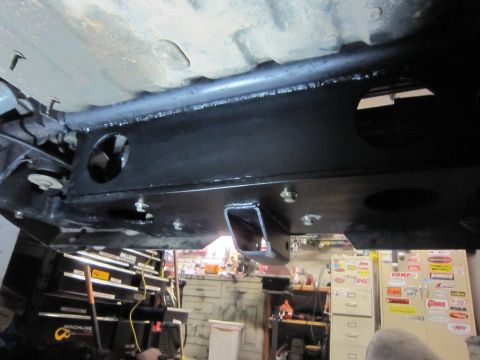2008 Jeep Wrangler - Close-up view of a vehicle's underbody, focusing on a newly installed winch mount and surrounding chassis components.