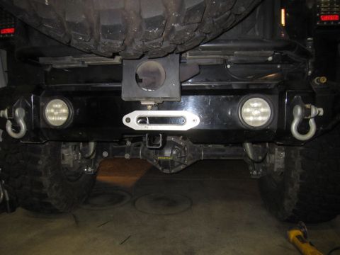 2008 Jeep Wrangler - Aftermarket rear bumper assembly a winch, tow hooks, and integrated LED lights.