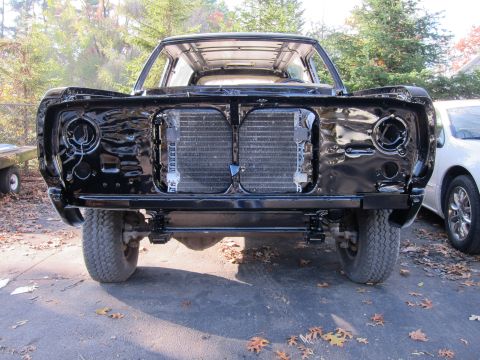 1987 Dodge 1500 - Front clip of a Dodge truck, likely from the early 1980s, with the radiator and front suspension visible.