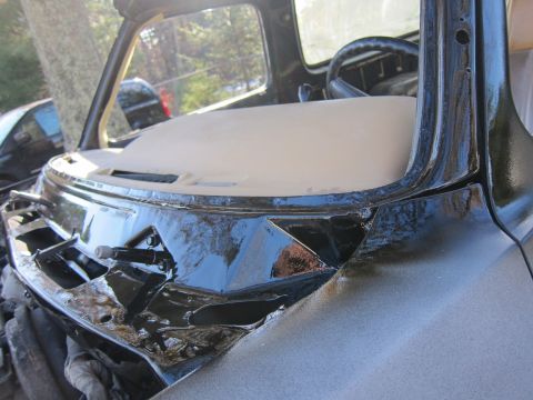 1987 Dodge 1500 - Close-up of the dashboard and windshield frame of a 1987 Dodge 1500 during restoration work.