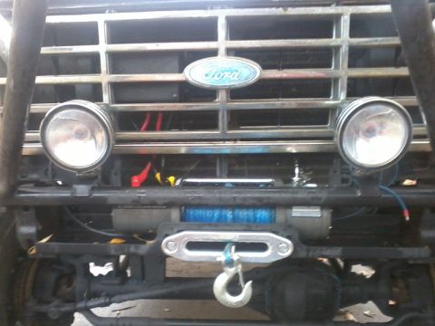 1986 Ford Bronco - Front view of a 1986 Ford Bronco, showing the grille, headlights, and a winch.