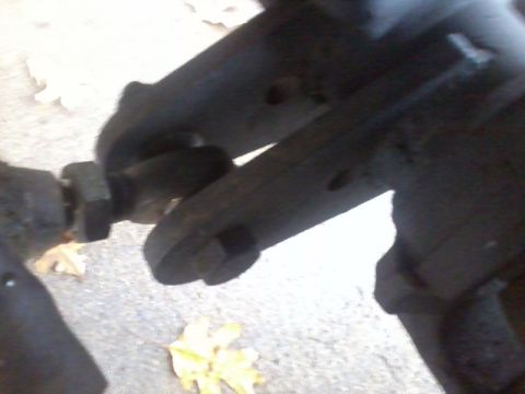 1986 Ford Bronco - A close-up view of a vehicle's suspension system, focusing on a connecting linkage.