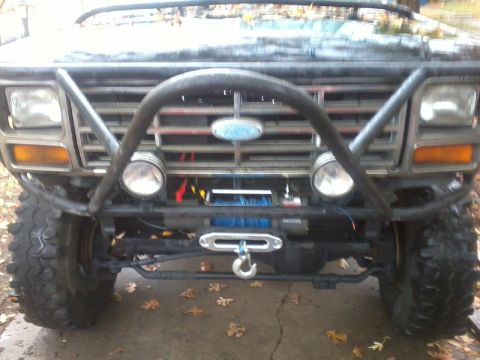 1986 Ford Bronco - Modified 1980s Ford Bronco front end a winch and brush guard.