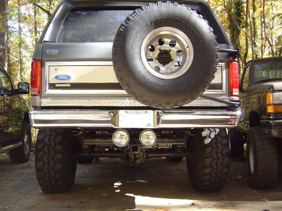 Gray Ford Bronco rear with spare tire, chrome bumper, and Georgia license plate