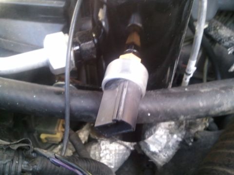 1994 Ford Bronco - Close-up of an AC system pressure sensor and associated plumbing.
